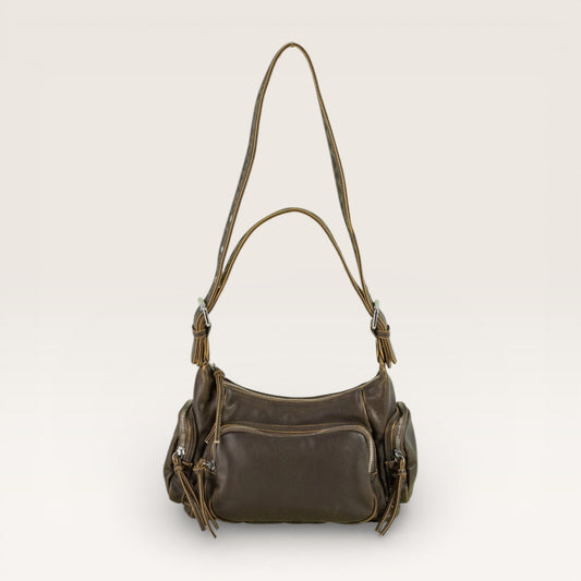 Brown leather handbag with a shoulder strap on a light beige background