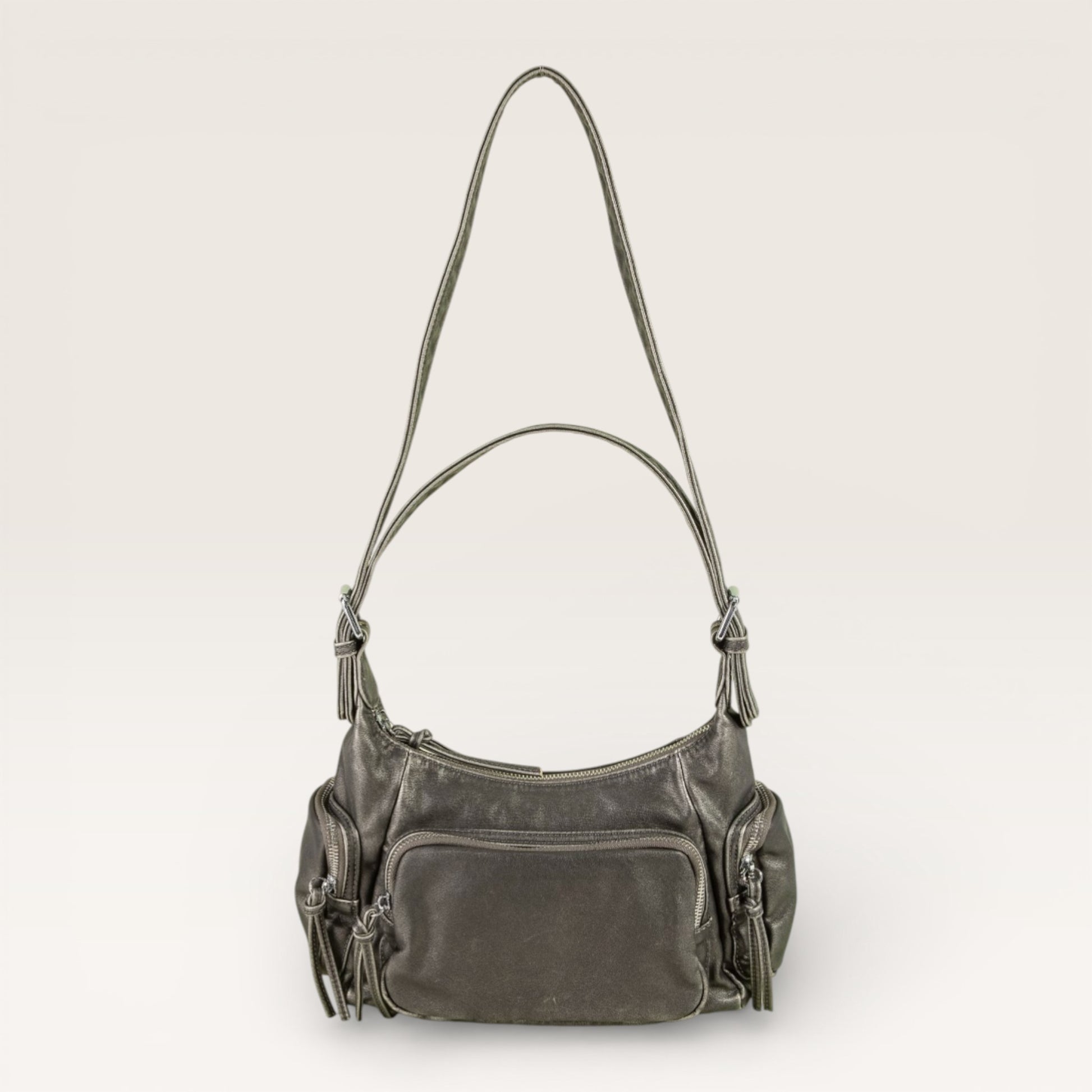 Gray handbag with multiple pockets on a light gray background