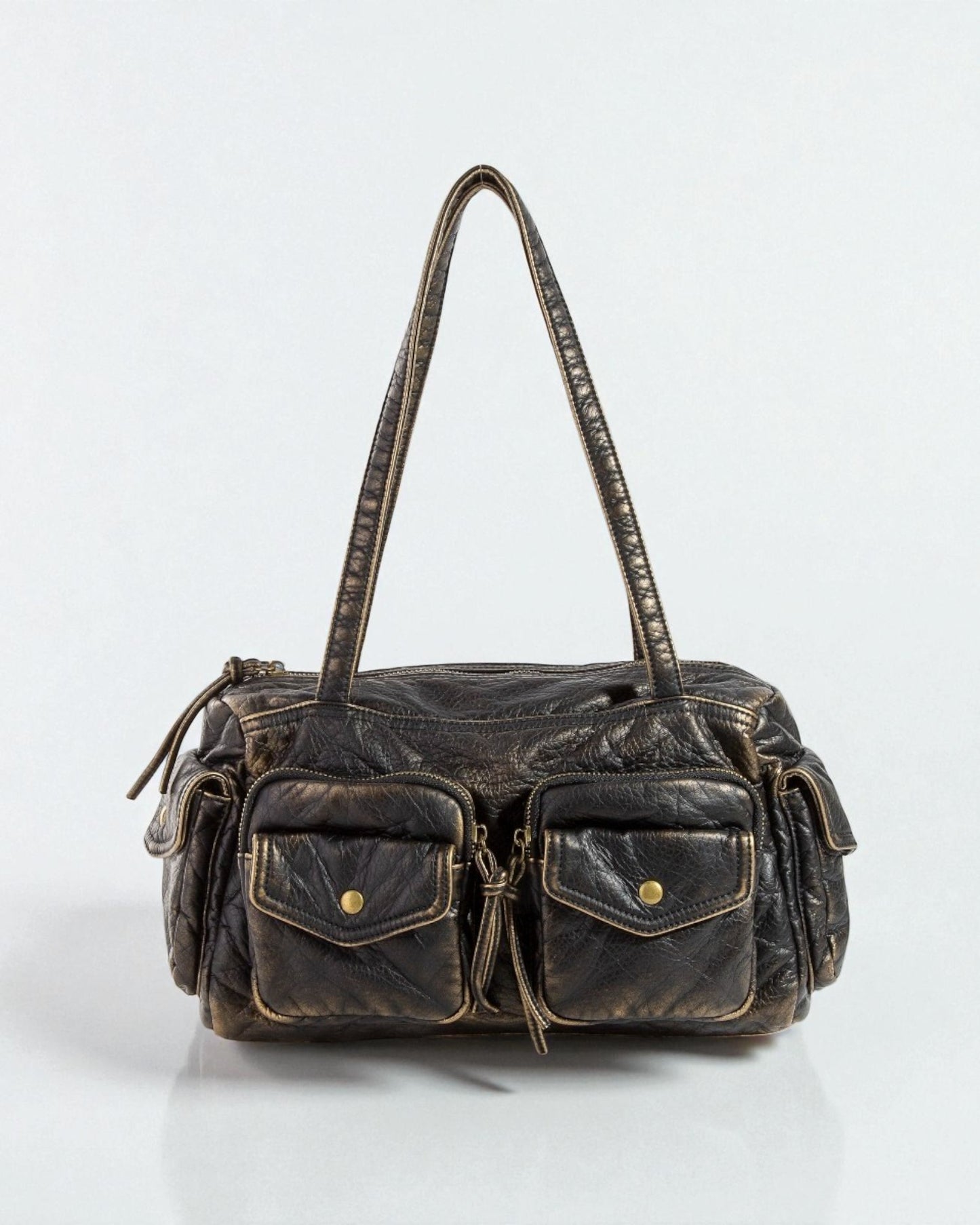 Vintage-style black leather handbag with gold accents on a white background