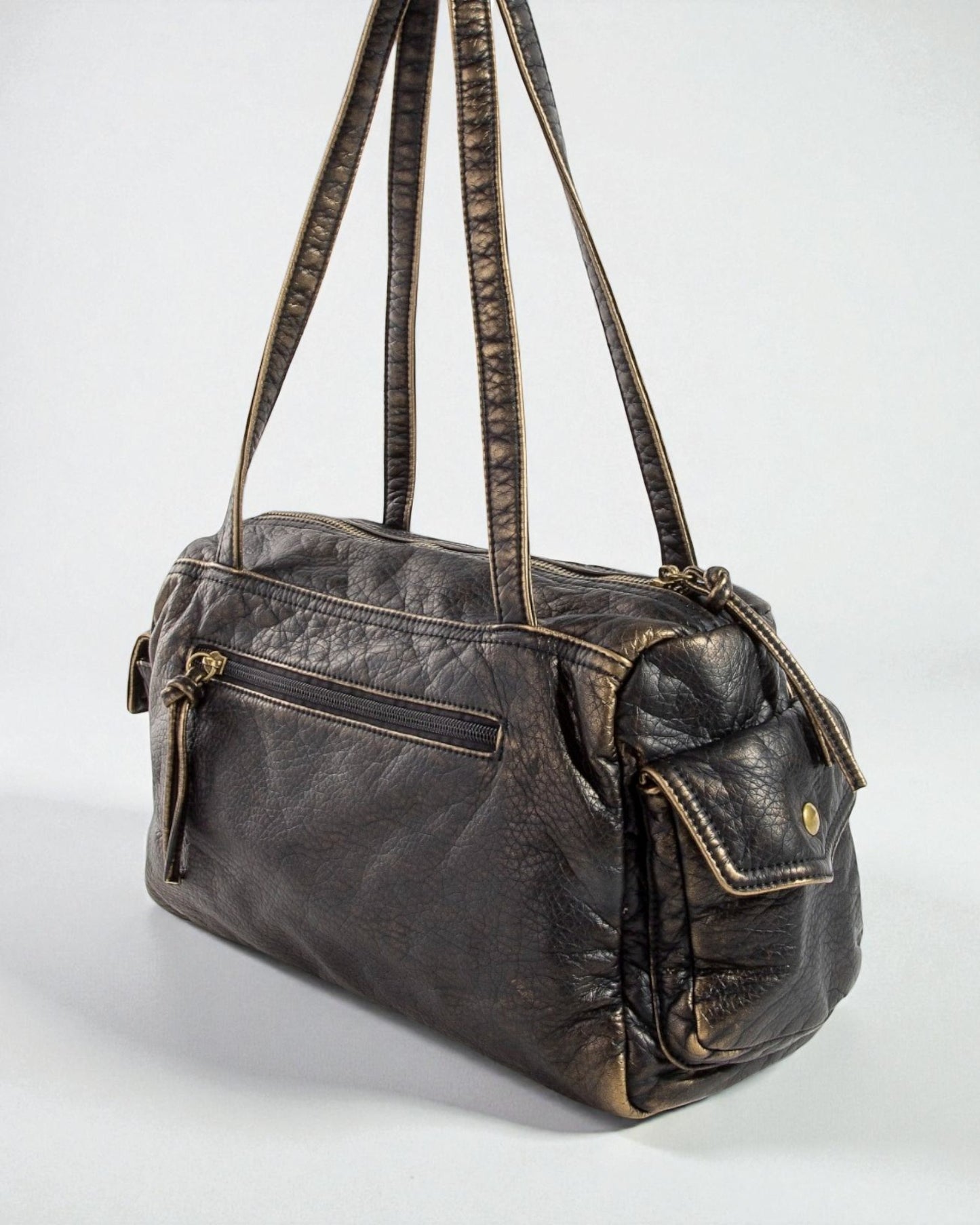 Brown leather handbag with visible wear on a white background