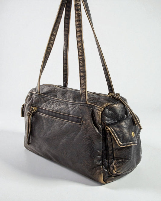 Brown leather handbag with visible wear on a white background