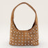 Brown handbag with silver studs on a white background