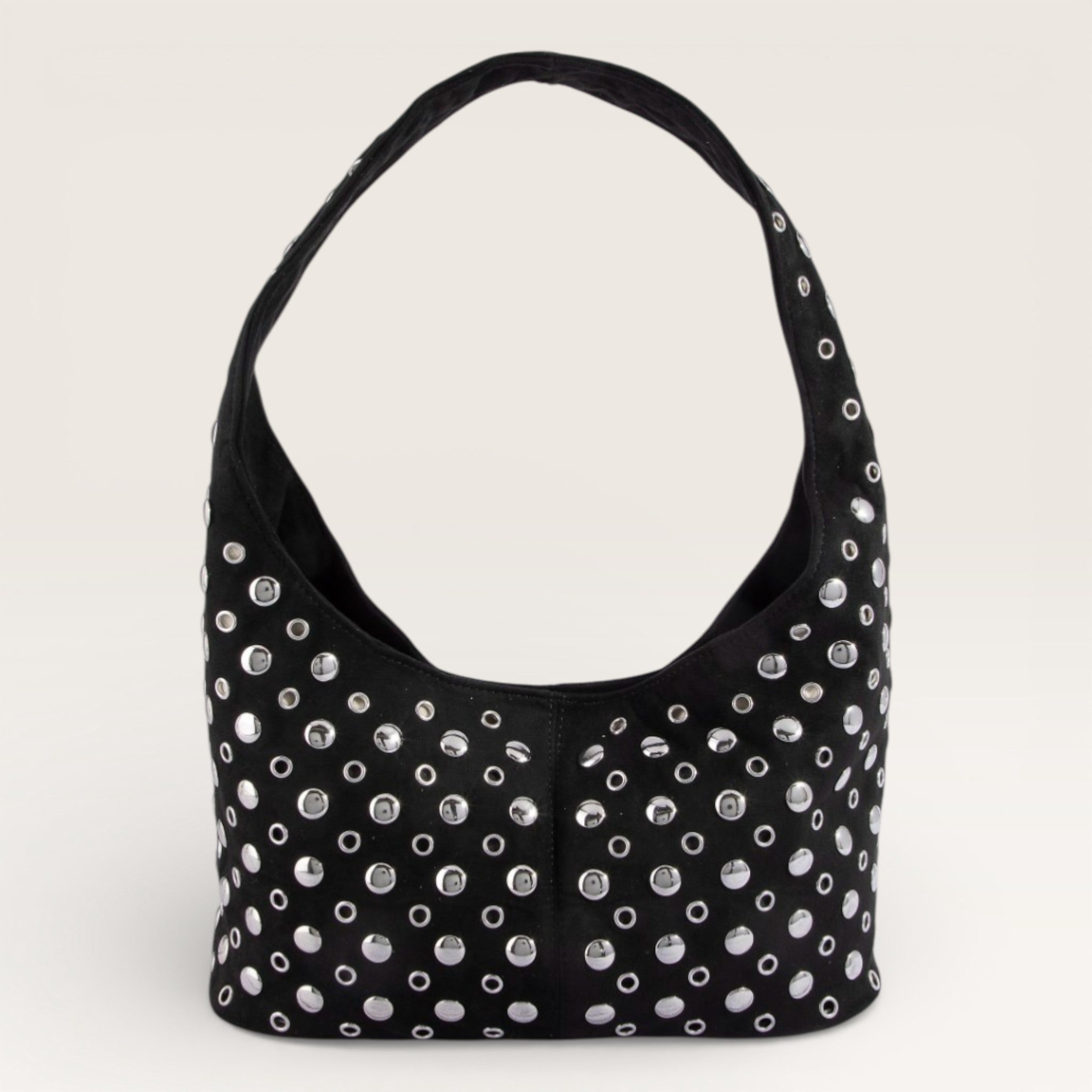 Black handbag with silver studs on a light gray background