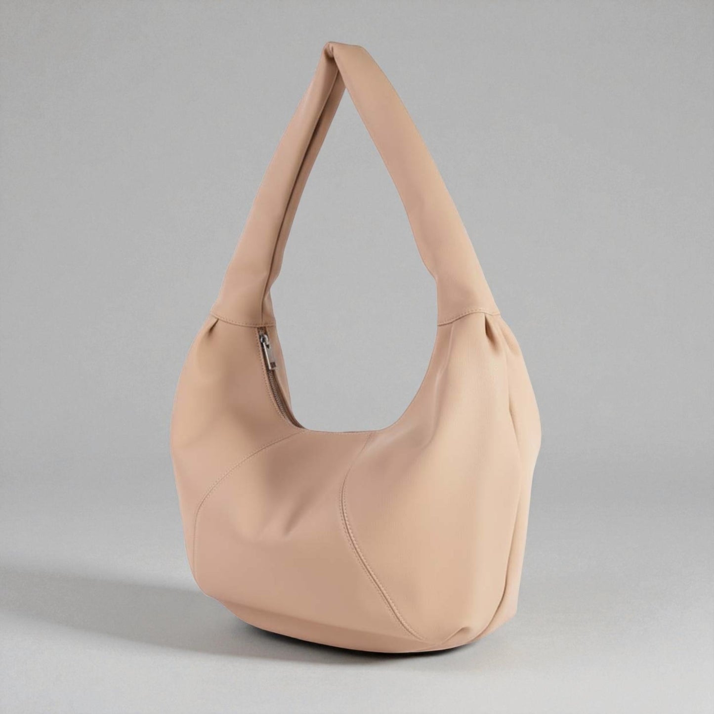 Beige handbag on a gray background