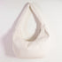 White bean bag chair on a light pink background