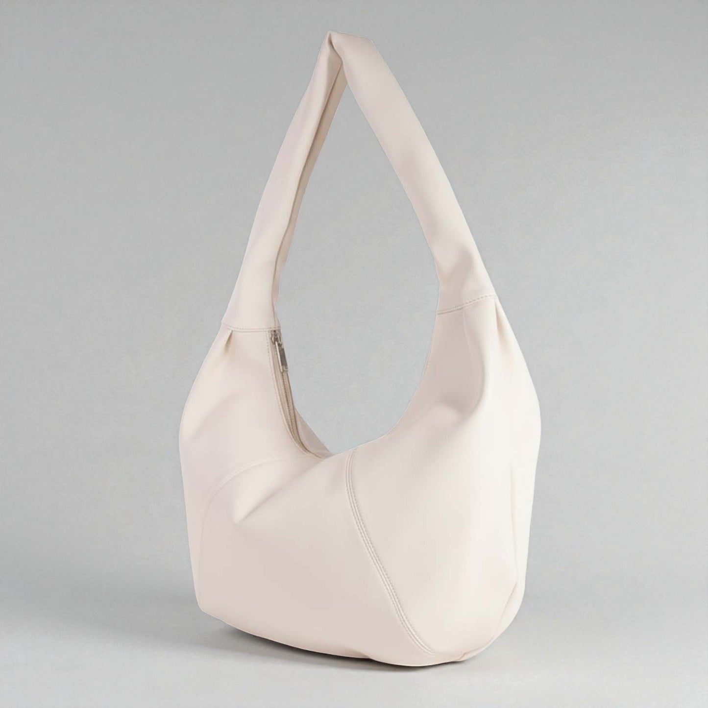 Beige handbag on a gray background