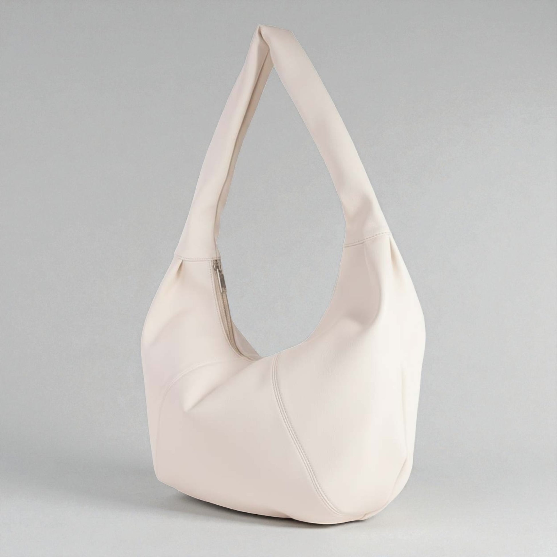 Beige handbag on a gray background