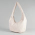 Beige handbag on a gray background