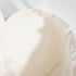 Close-up of a beige bra on a white background