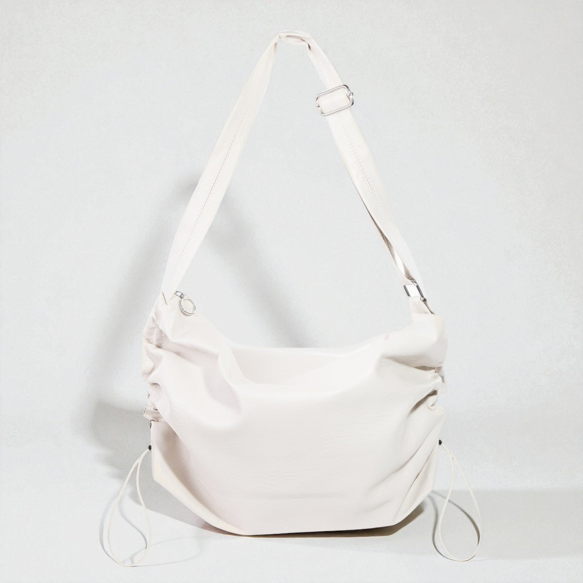 White shoulder bag on a light gray background