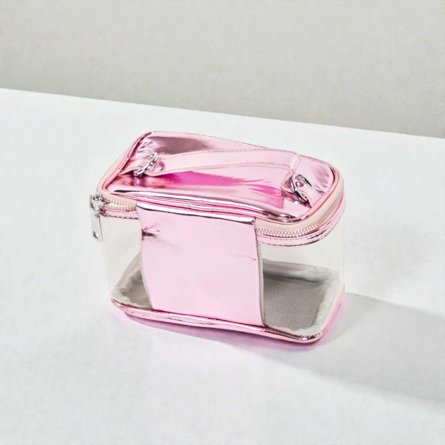Pink and clear rectangular pouch on a light gray background