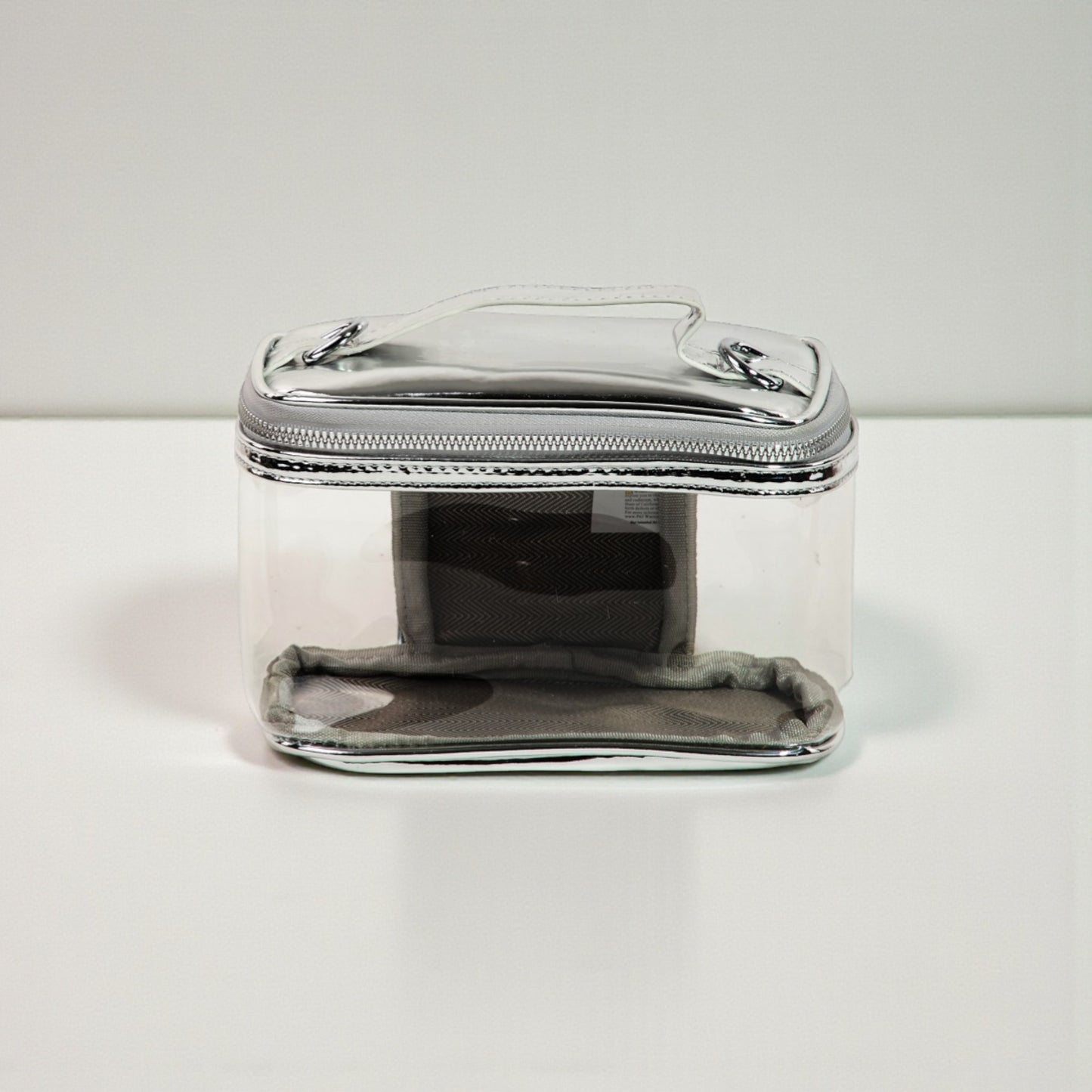 Clear plastic container with a zipper on a white background