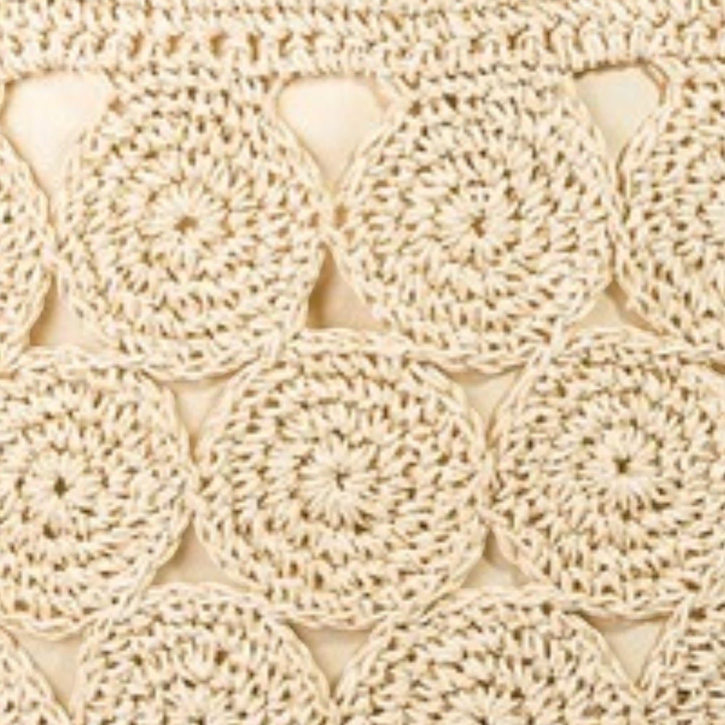 Beige crocheted doilies stacked on top of each other