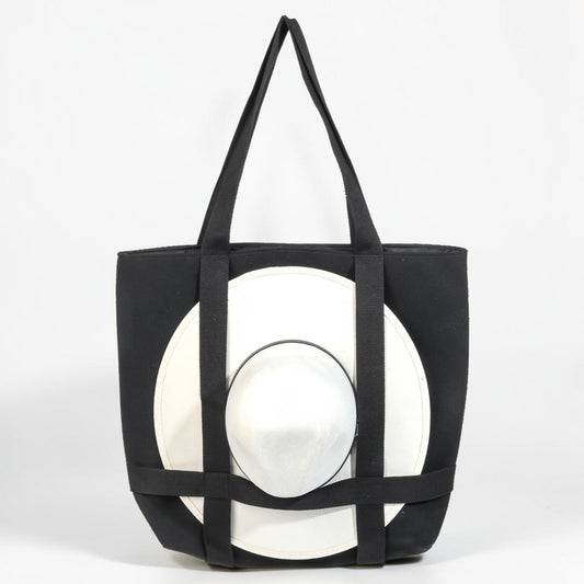 Black tote bag with geometric design on a white background