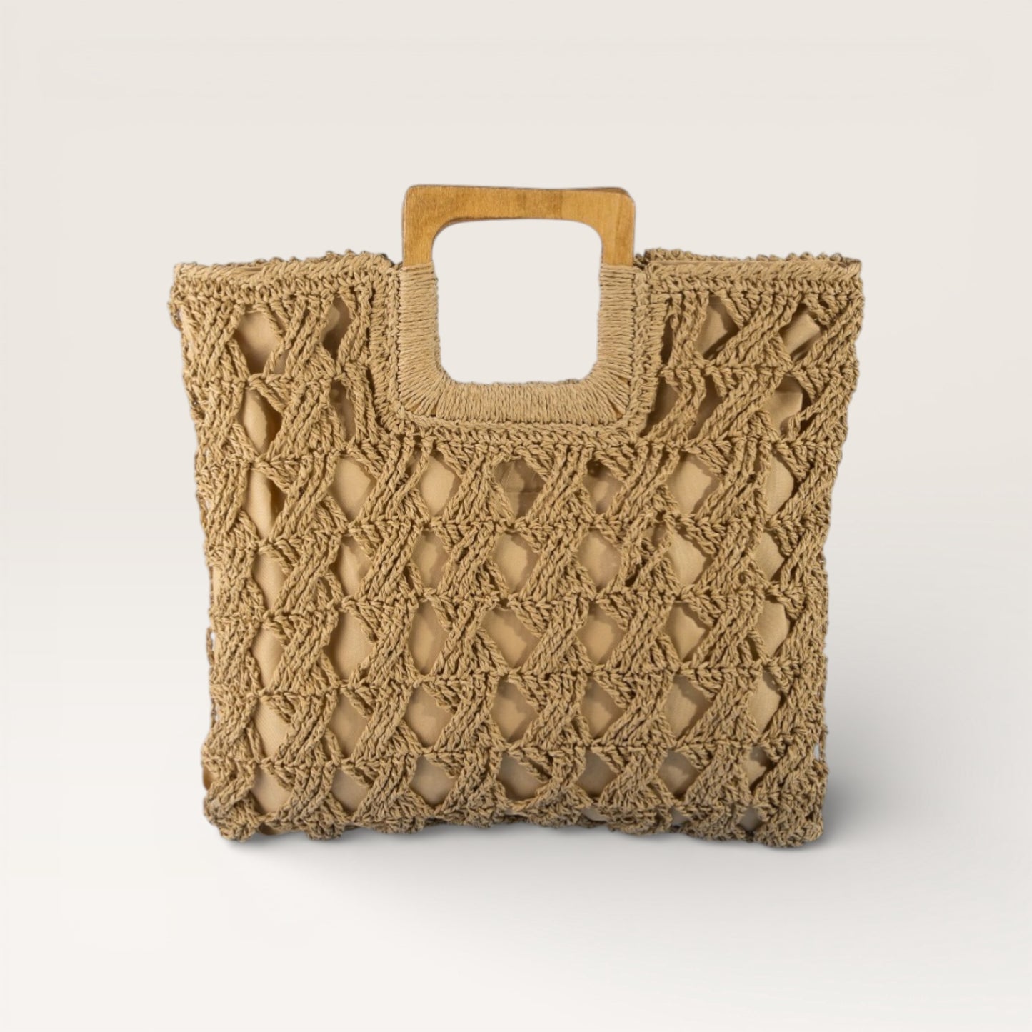 Beige woven tote bag with wooden handle on a light beige background