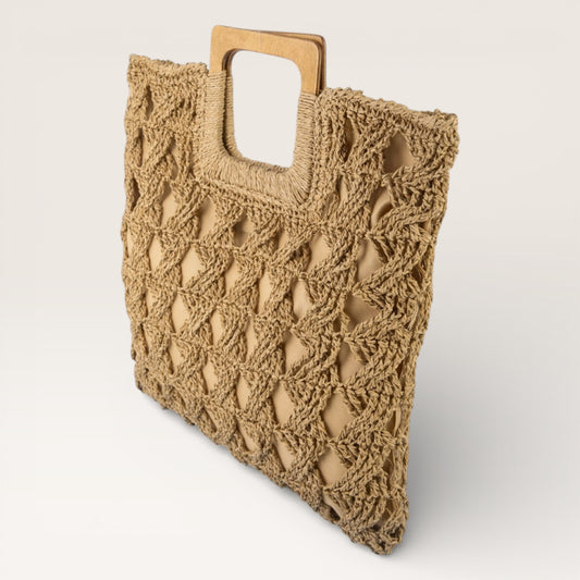 Beige crochet bag with wooden handle on a light beige background