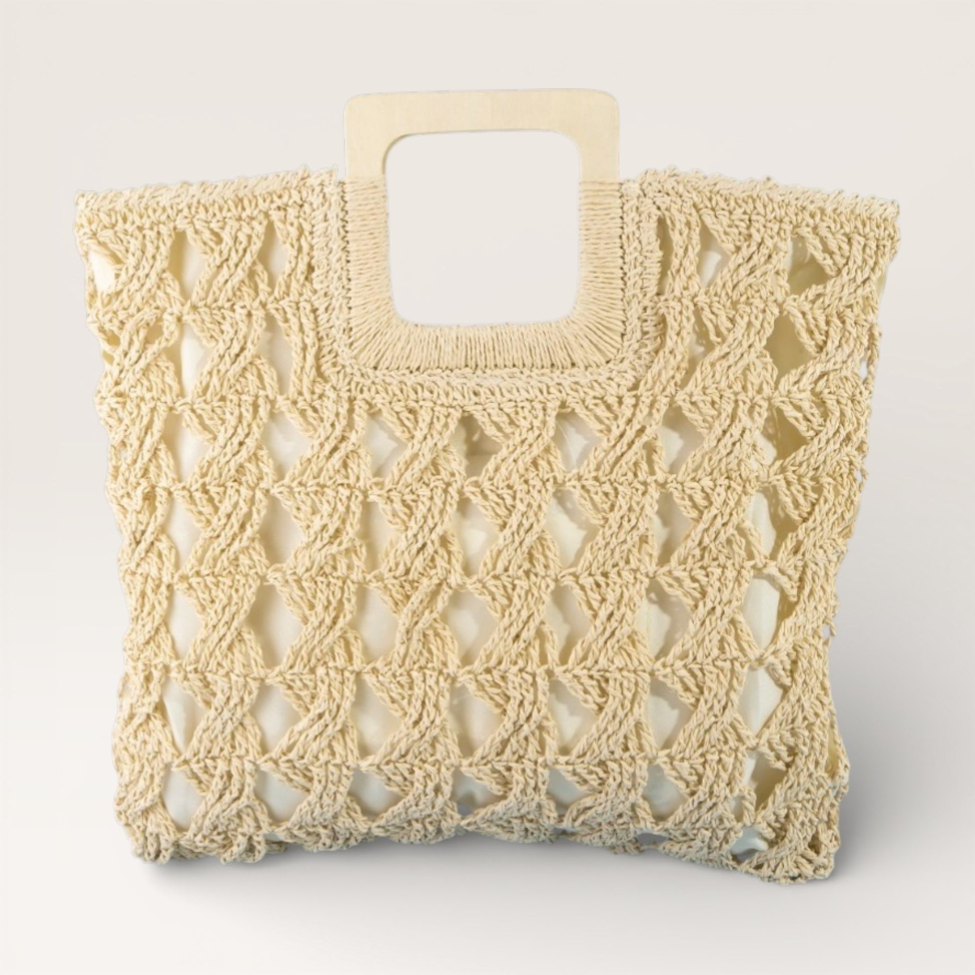 Beige woven handbag with wooden handle on a light gray background