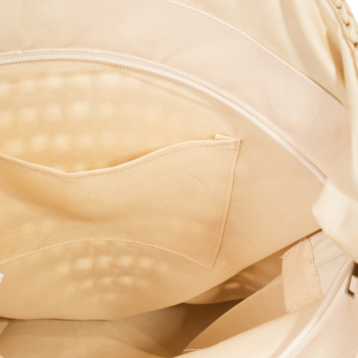 Close-up of a beige backpack with textured surface