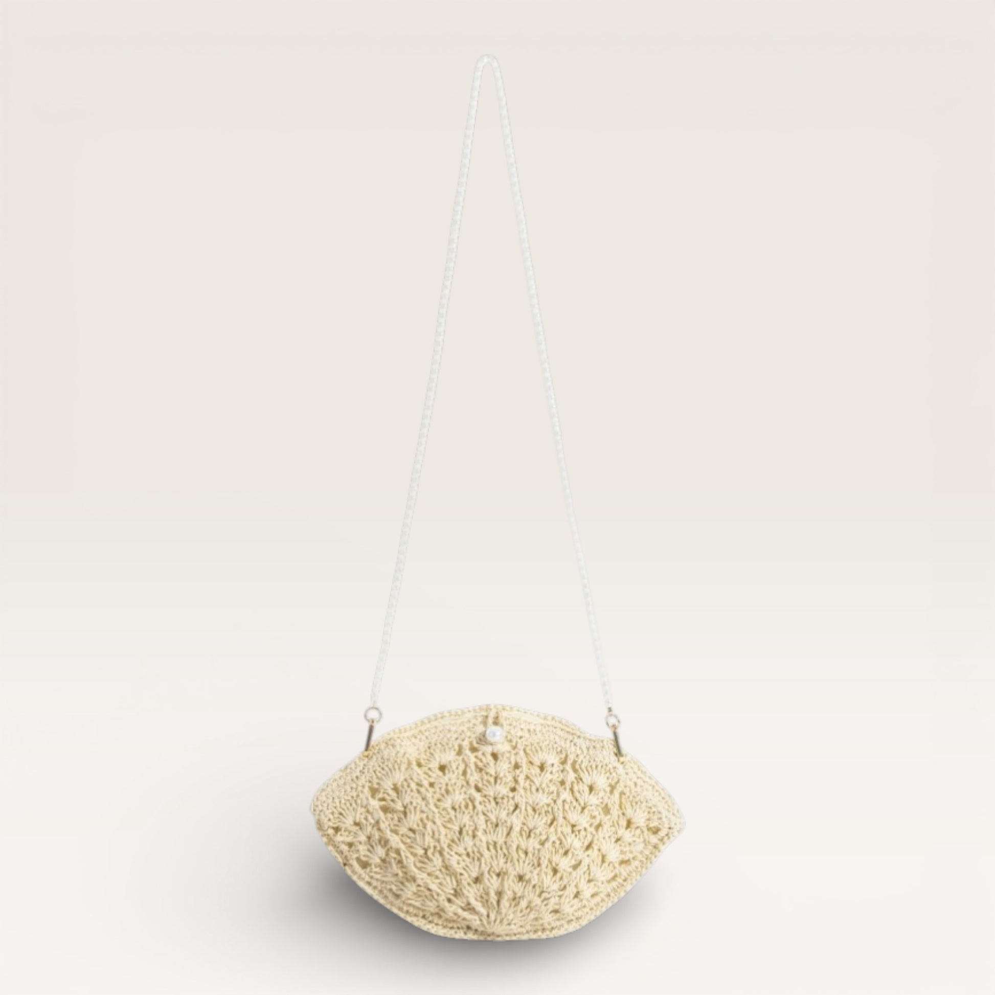 Crocheted beige bag on a white background