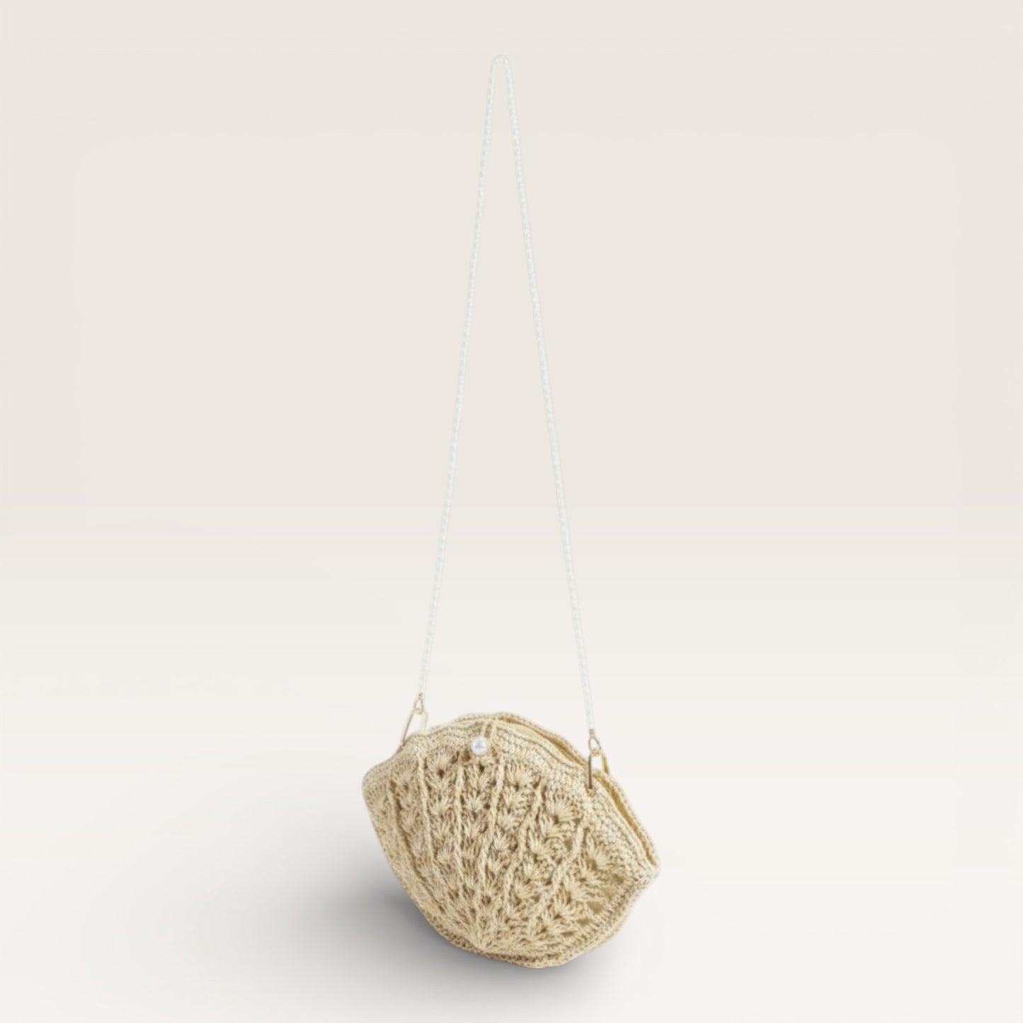 Textured beige pendant hanging against a light gray background