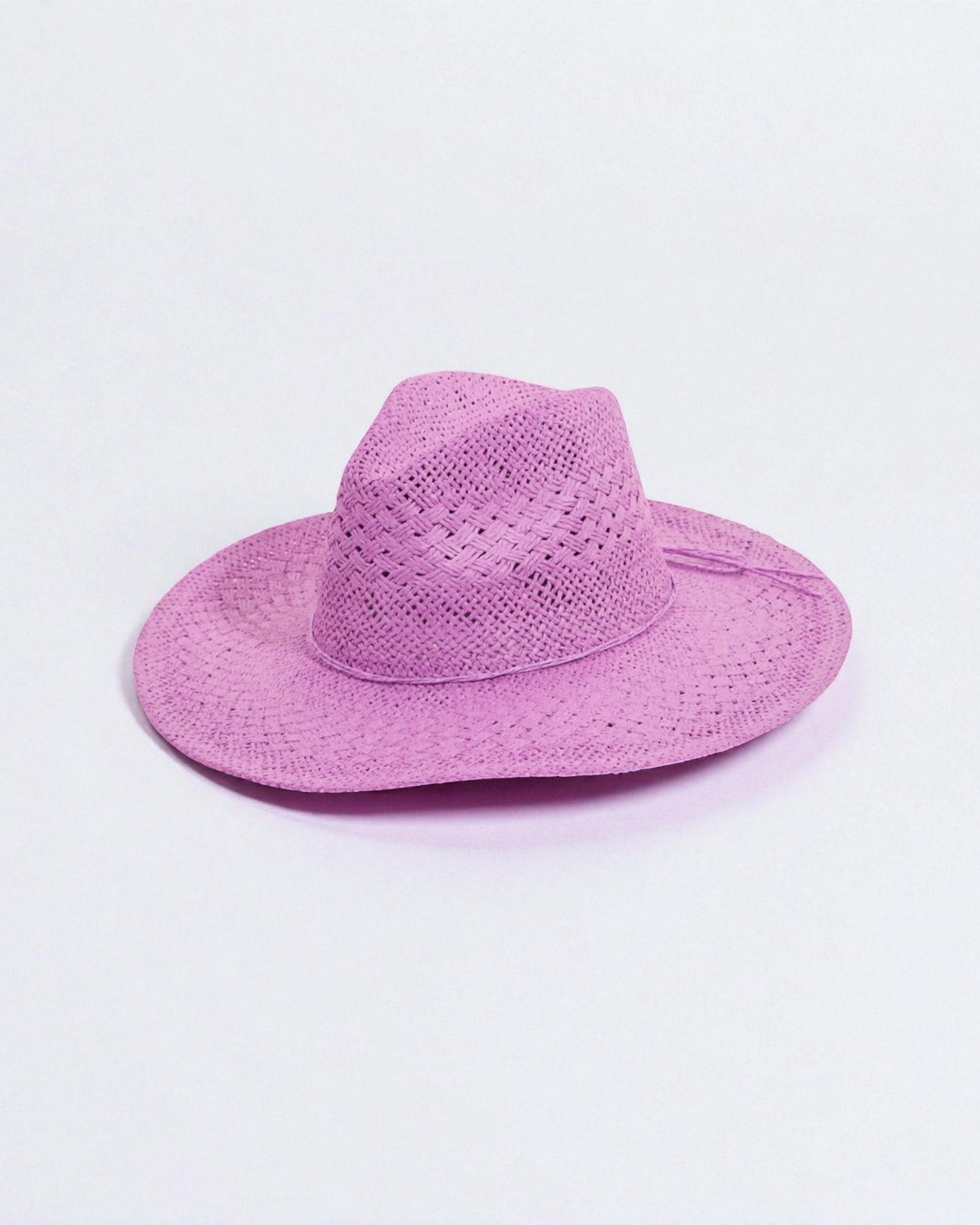 Purple straw hat on a light purple background