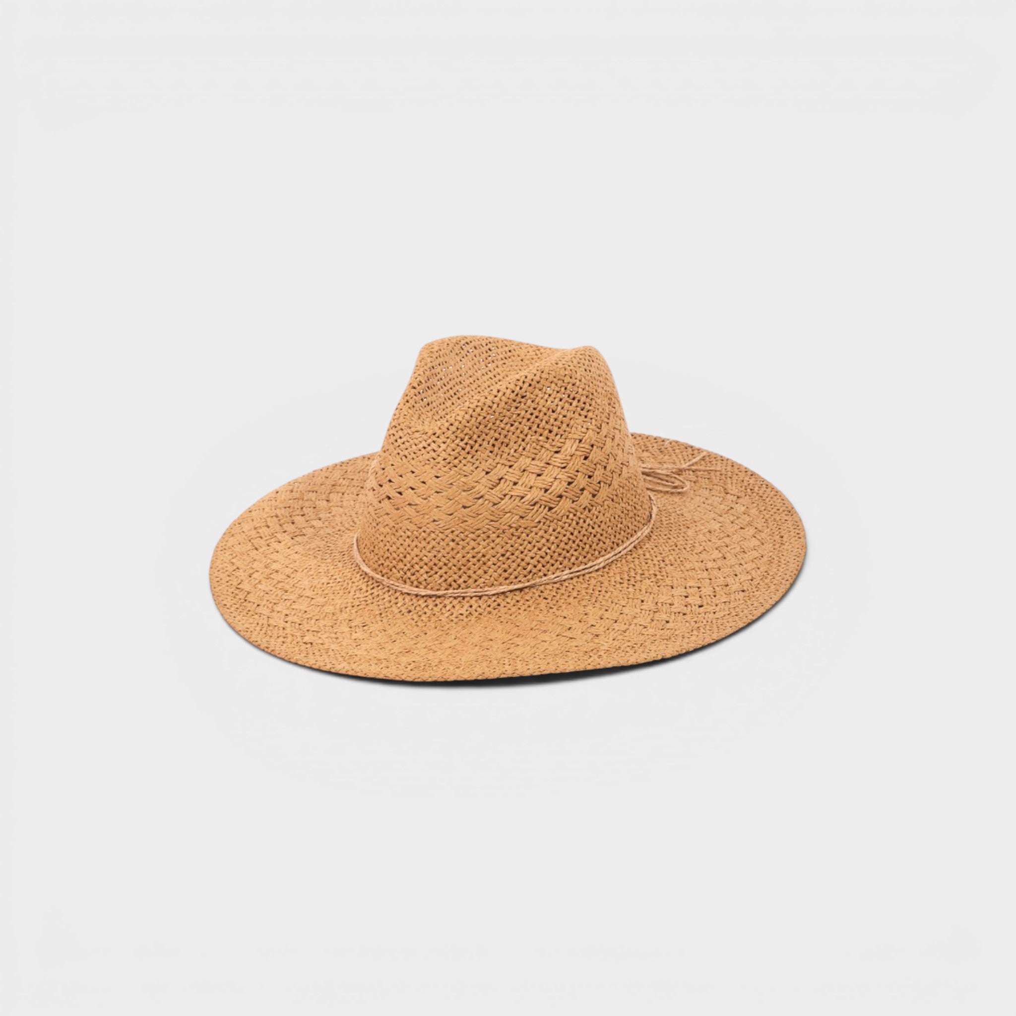 Tan straw hat on a light gray background