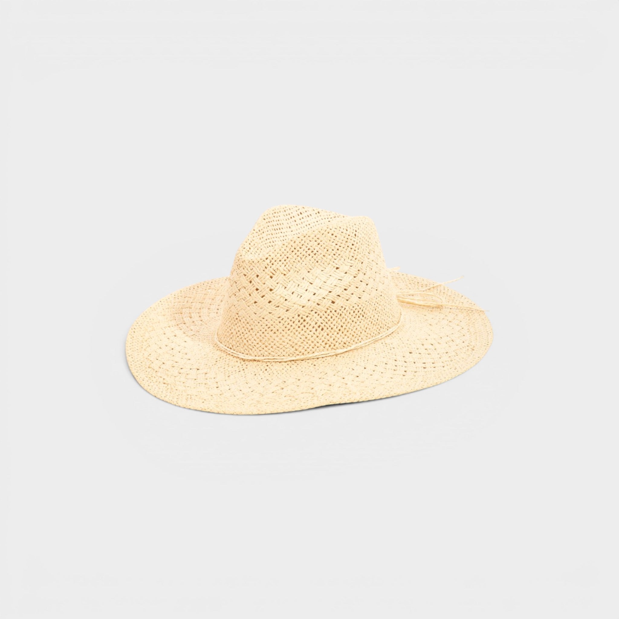 Beige straw hat on a light gray background