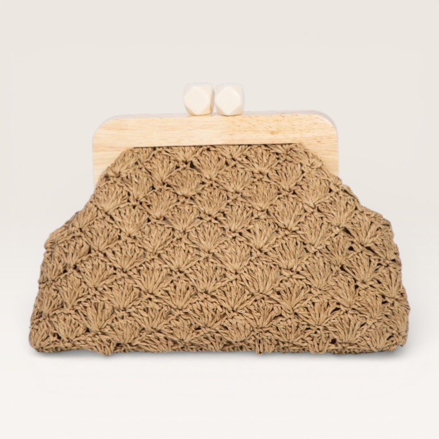 Brown crochet clutch bag with wooden frame on a light gray background
