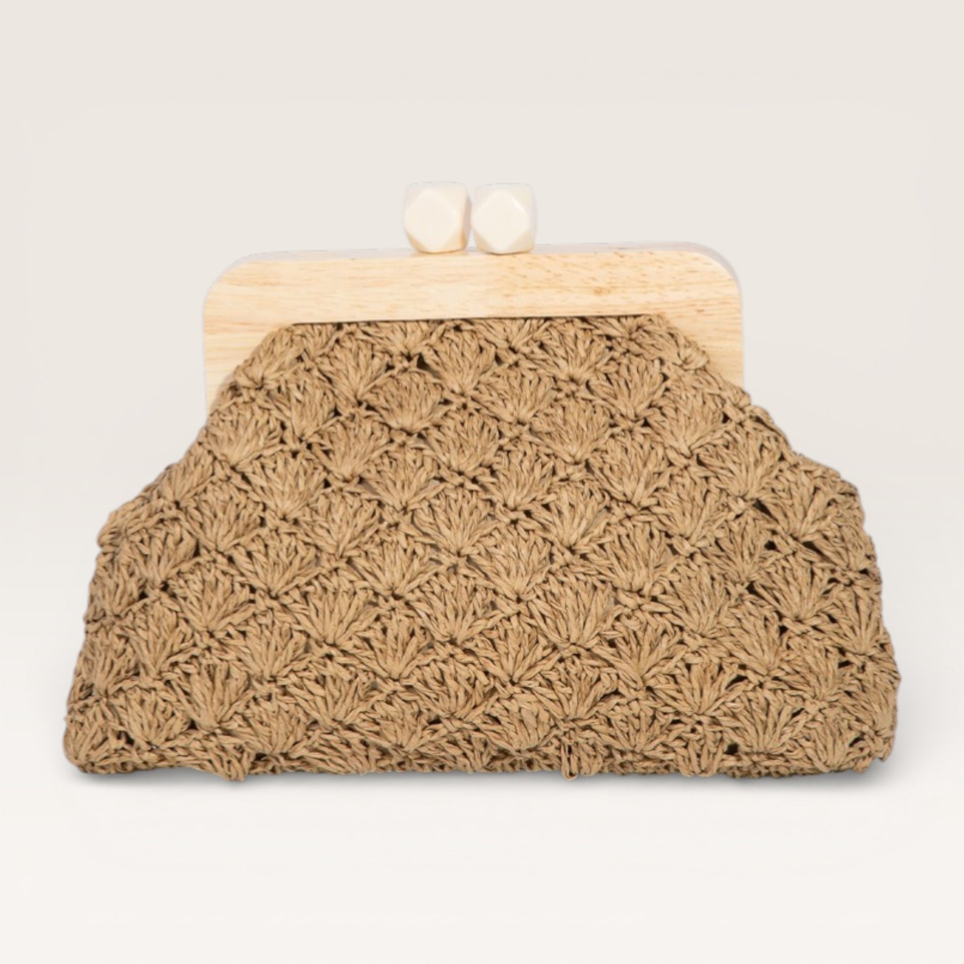 Brown crochet clutch bag with wooden frame on a light gray background