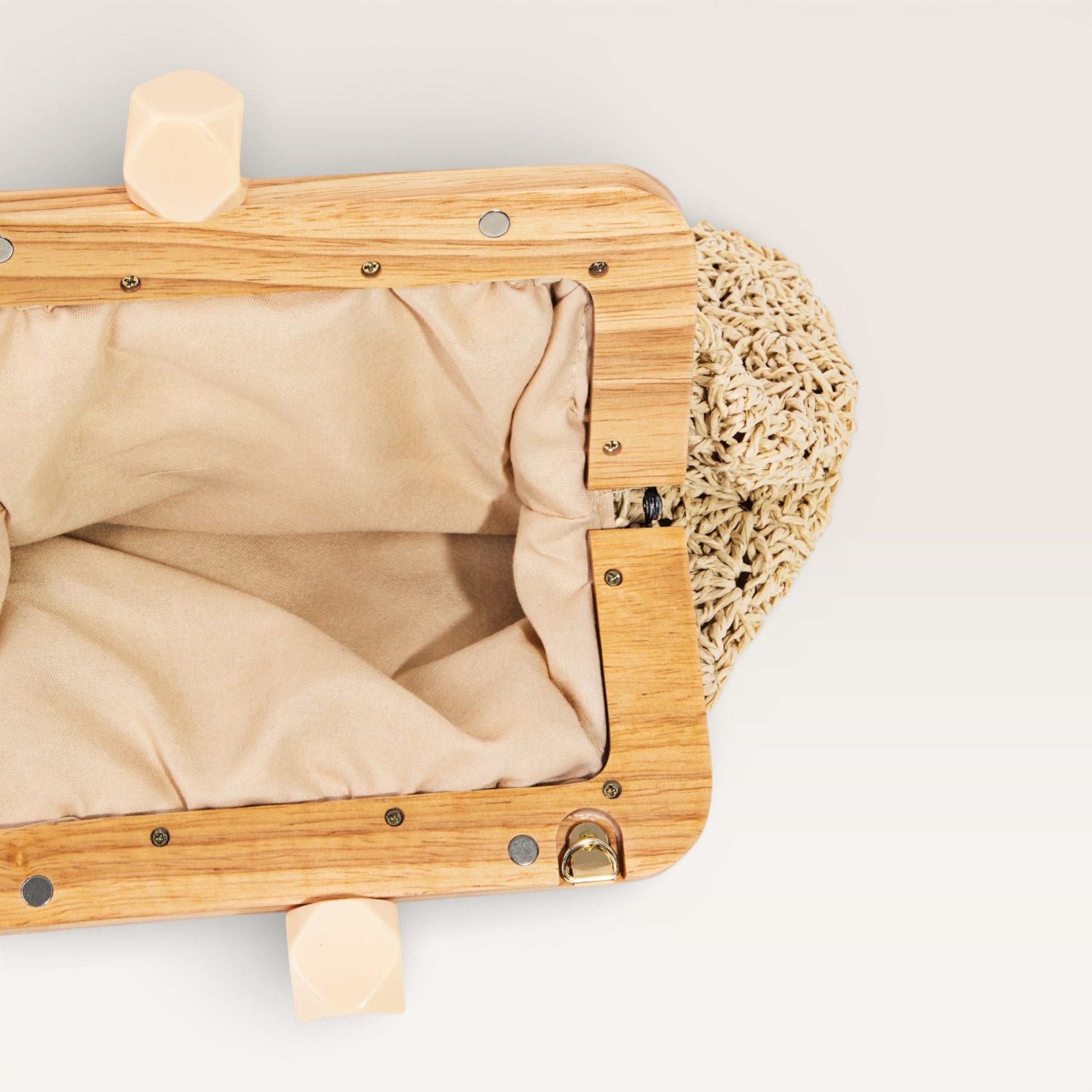 Wooden pet carrier with beige interior and textured surface on a light background