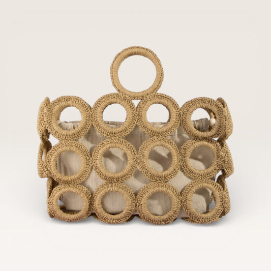 Woven basket with circular patterns on a beige background