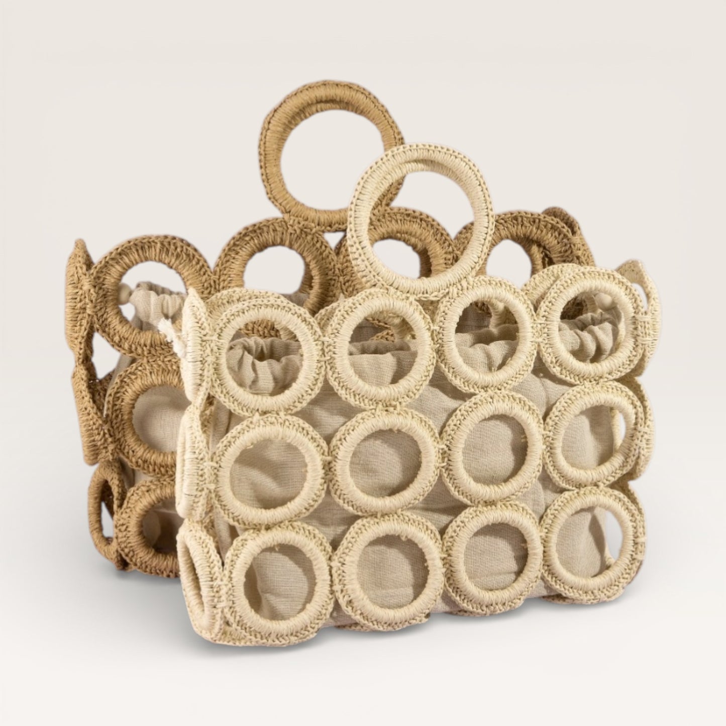 Decorative woven basket with circular patterns on a light background