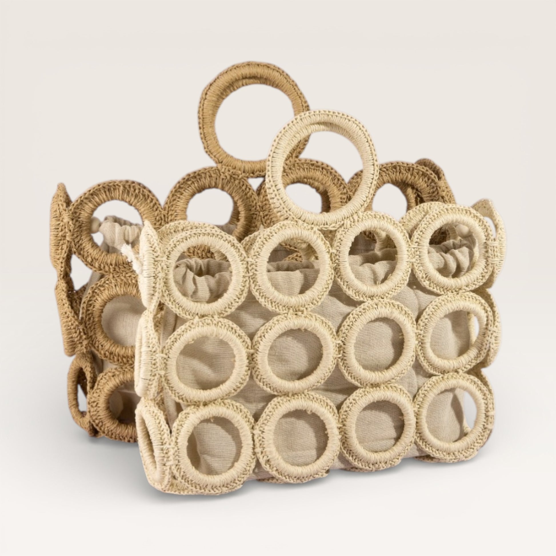 Decorative woven basket with circular patterns on a light background