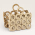 Decorative woven basket with circular patterns on a light background