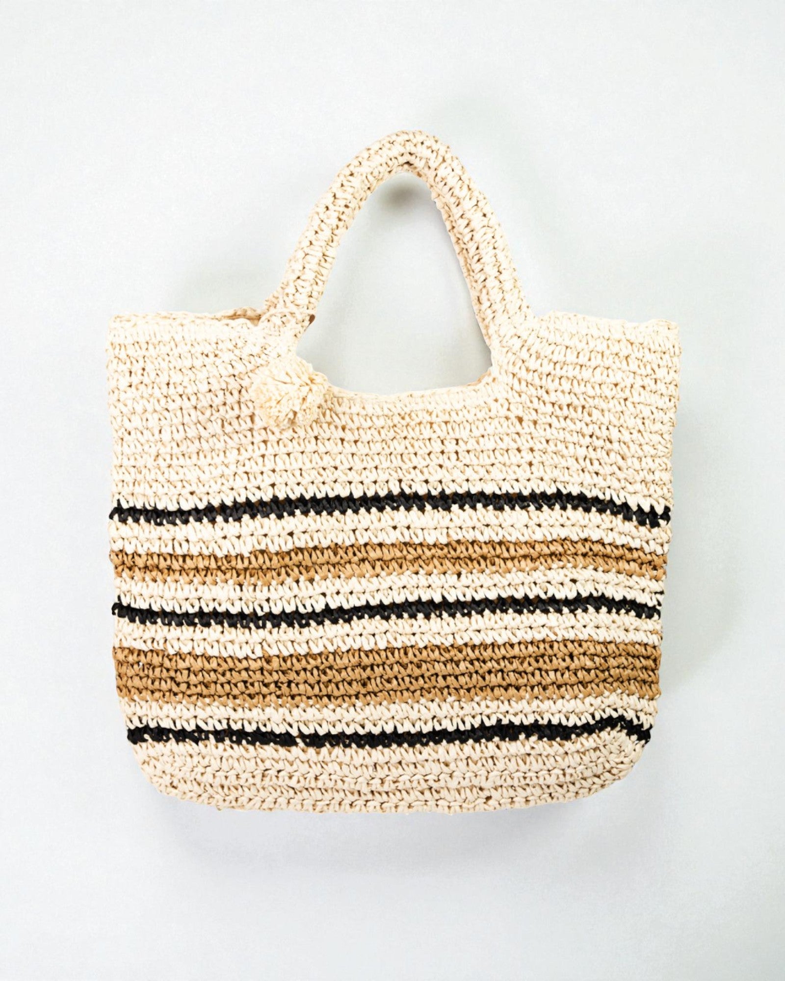 Woven tote bag with striped pattern on a light gray background
