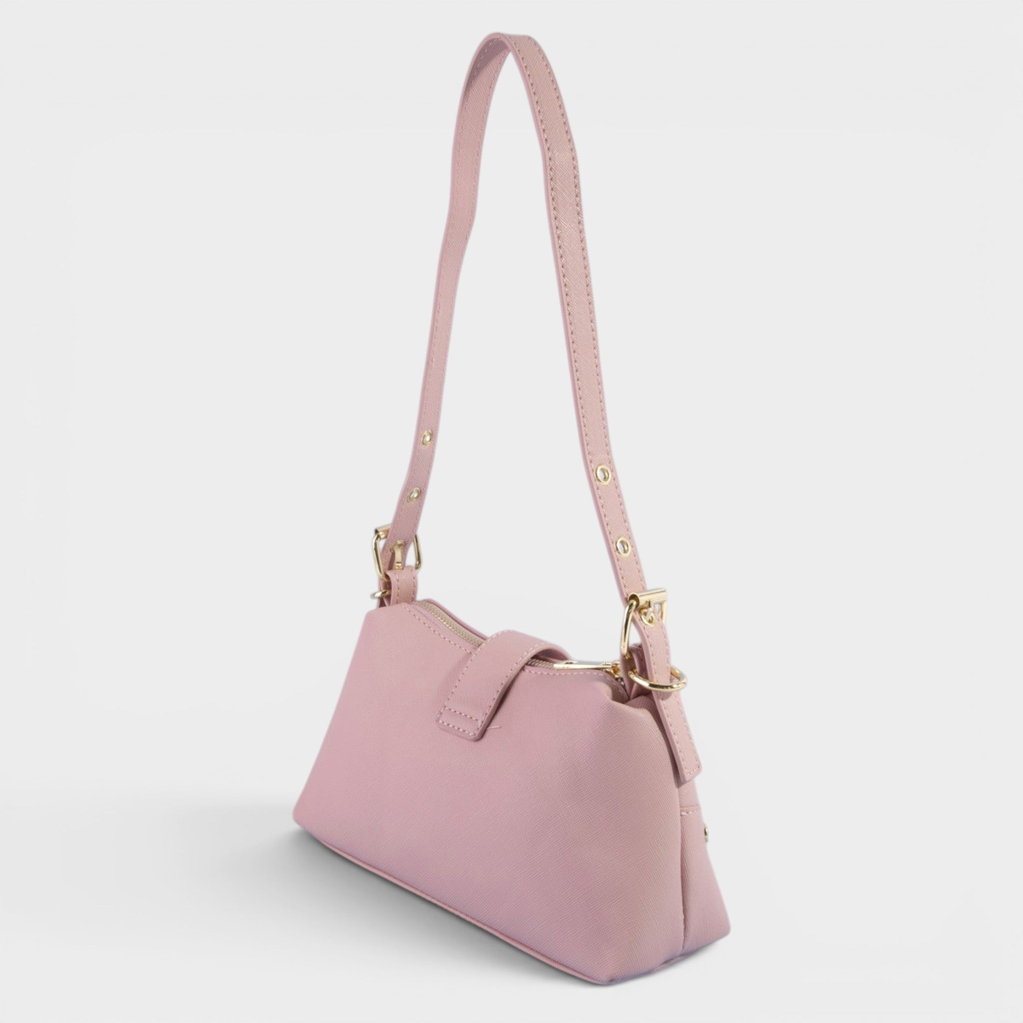 Pink handbag with a strap on a light gray background
