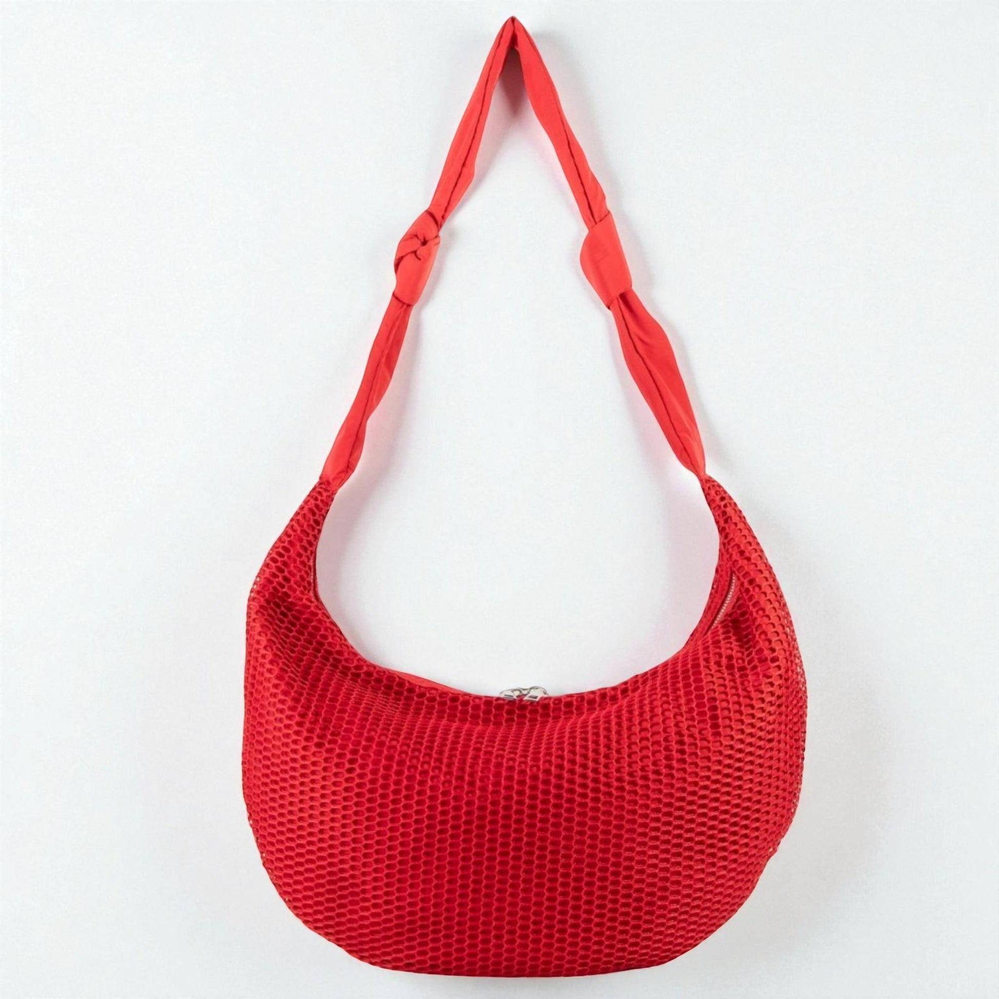 Red woven handbag on a white background