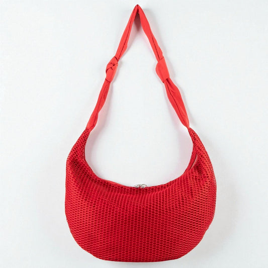 Red woven handbag on a white background