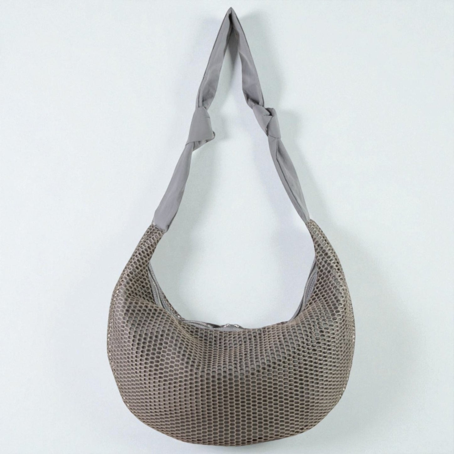 Mesh shopping bag with a gray handle on a white background