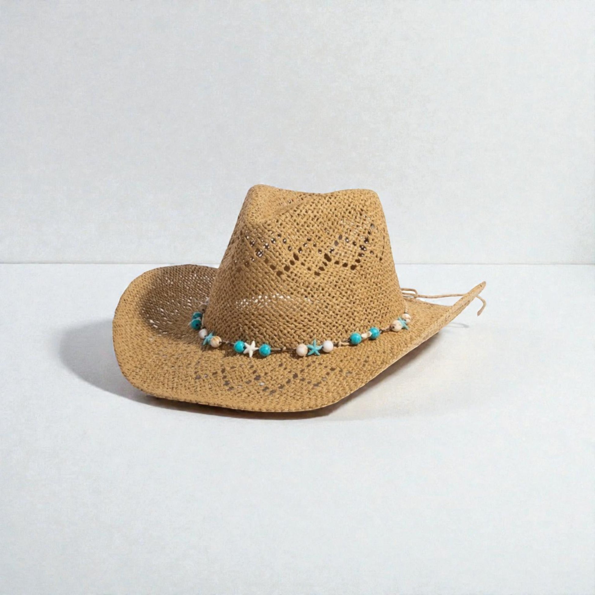 Straw hat with a decorative band on a light gray background