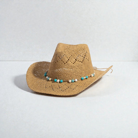 Straw hat with a decorative band on a light gray background