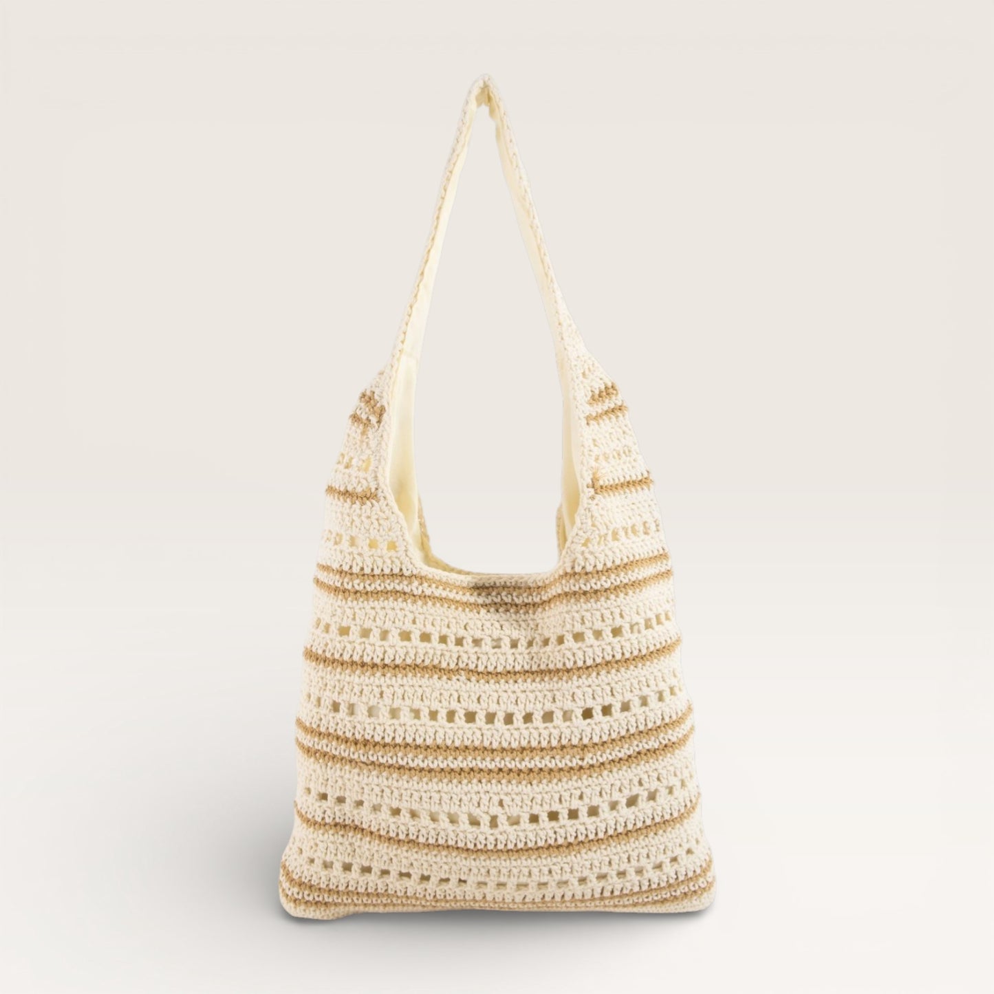 Crocheted bag with a striped pattern on a light gray background