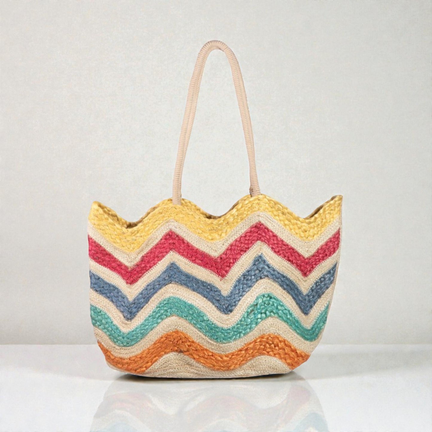 Colorful zigzag patterned bag on a light gray background