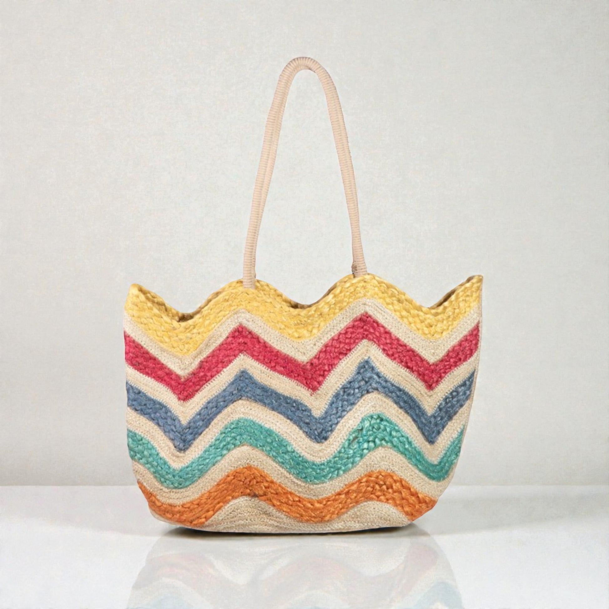 Colorful zigzag patterned bag on a light gray background