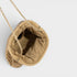 Beige handbag with a gold chain on a light gray background