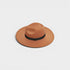 Brown hat with a black band on a light gray background
