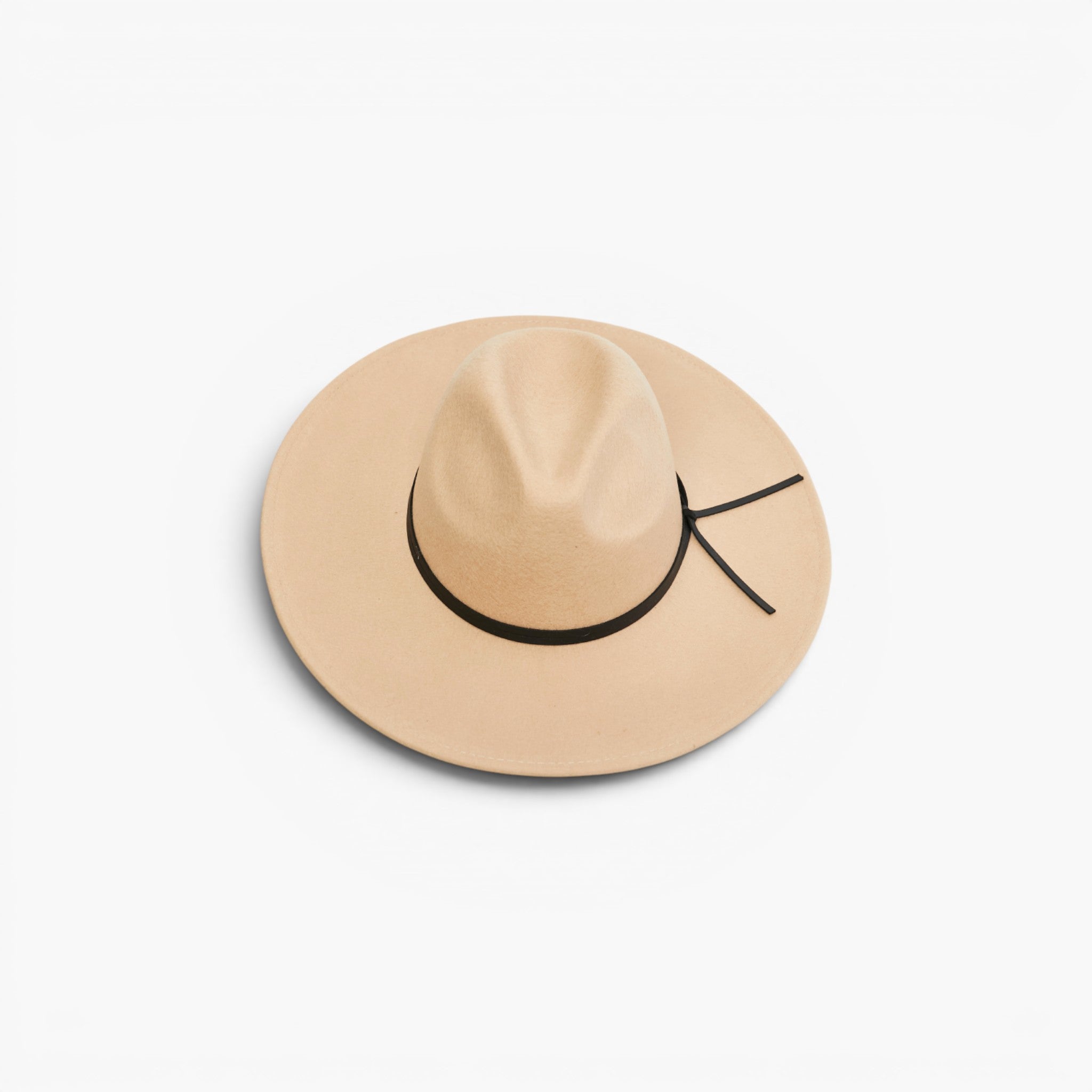 A light beige wide-brim fedora hat with a black ribbon band and bow, photographed from a top-down angle on a clean white background.