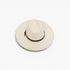 An off-white fedora hat with a black band around the crown, photographed from a top-down angle on a clean white background.