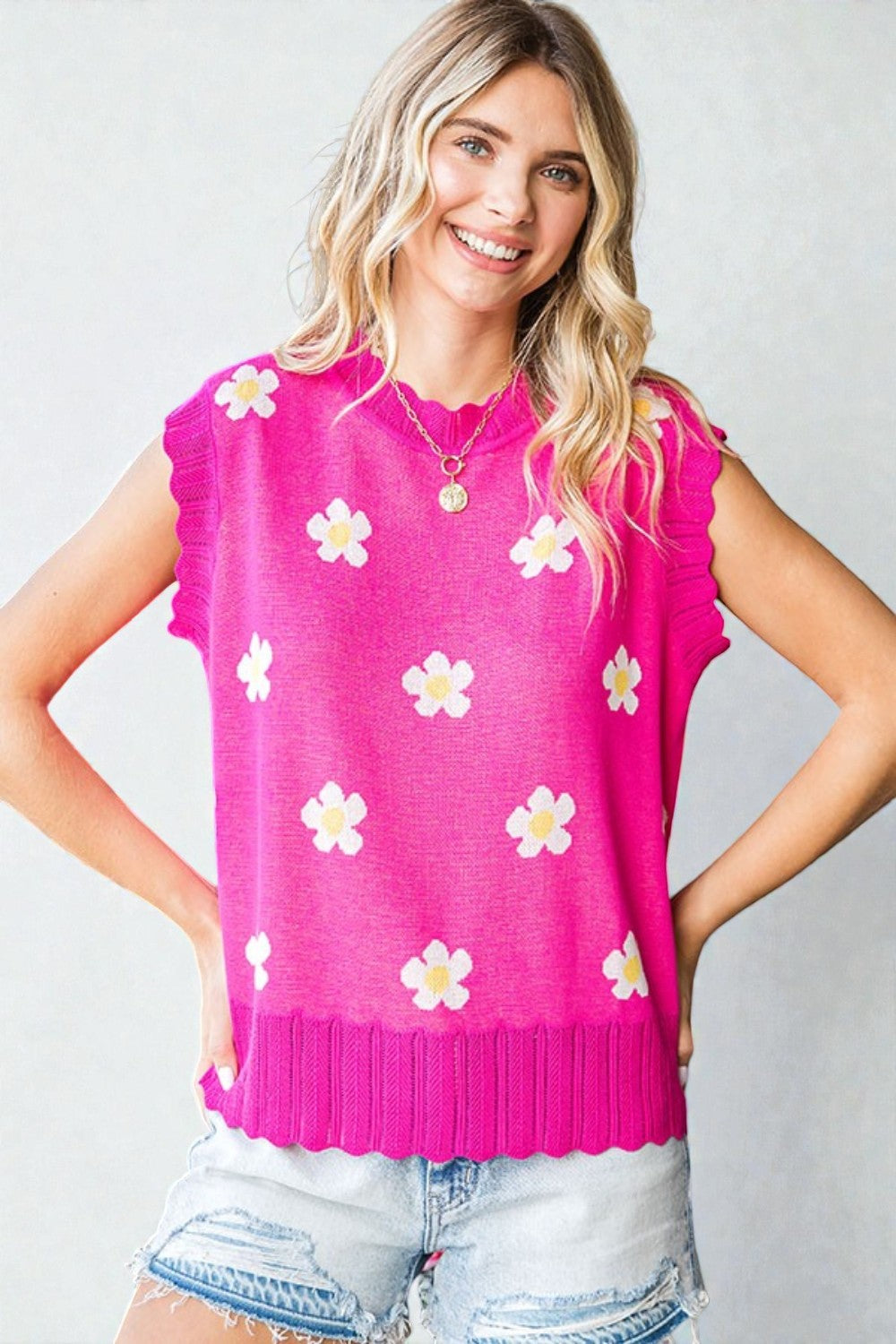 Pull sans manches à imprimé marguerites en fuchsia