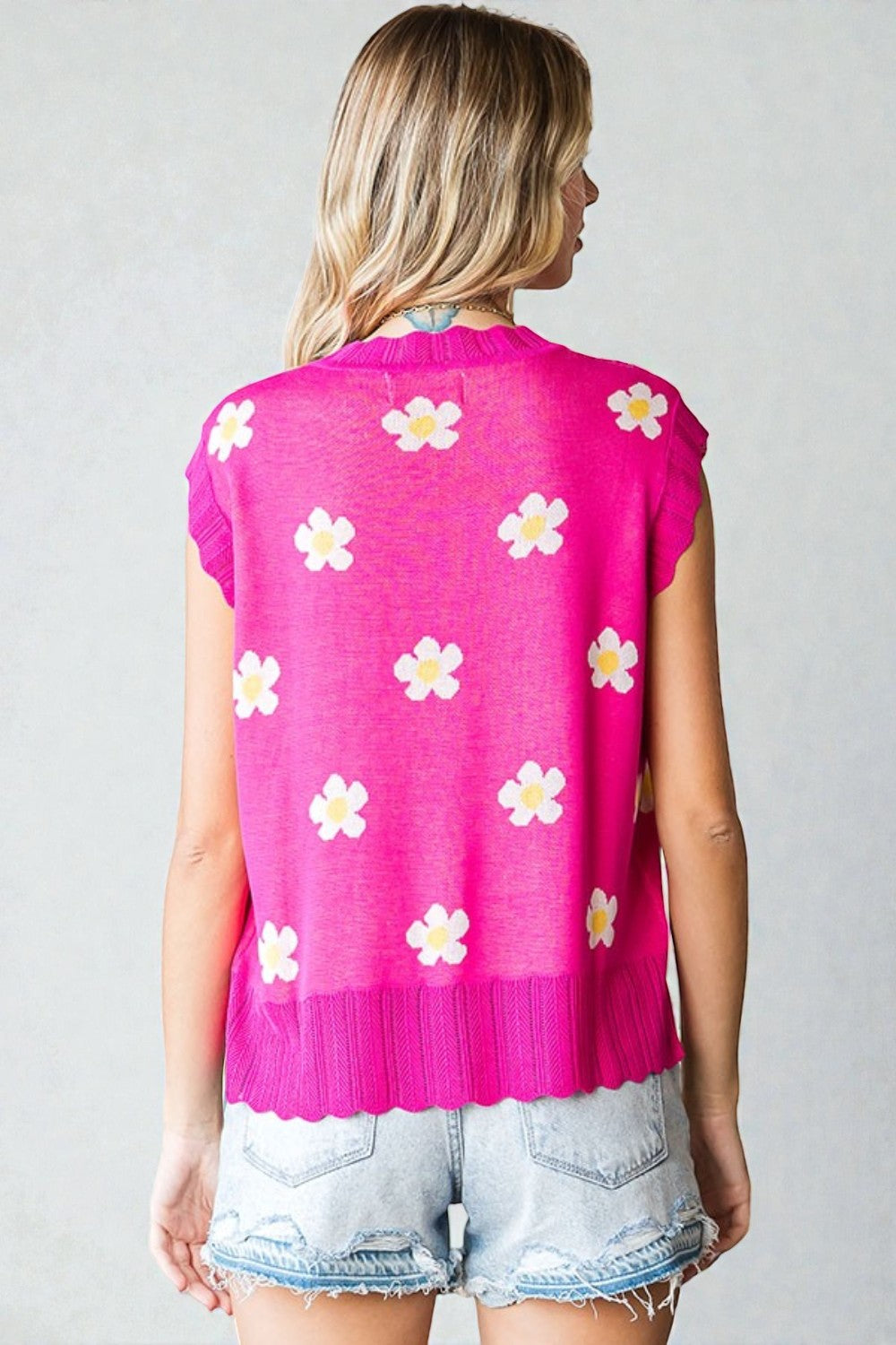 Pull sans manches à imprimé marguerites en fuchsia